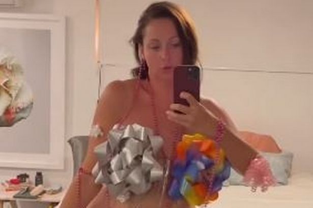 Mum covers nipples with gift wrap ribbons as she mocks Cardi B's risque outfit