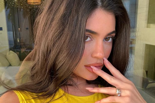 Kylie Jenner sucks on popsicle in skin tight 'wet' mini dress for sultry snaps
