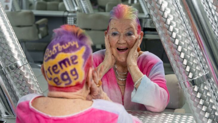 Pensioner gets egg-inspired hairdo as she cuts rainbow Mohawk to resemble a Cadbury’s Creme Egg