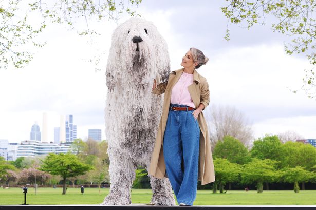 Helen Skelton takes a stroll in London park with a huge 'dog' - made out of mop heads