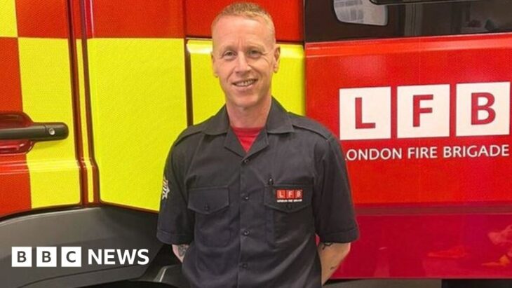 Steve Moore in front of a London Fire Brigade truck