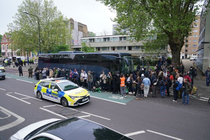 'Refugees are welcome here!': Peckham protesters blocking asylum seeker coach warned they face arrest